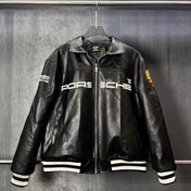 Black leather Porsche jacket on a hanger against a dark background