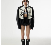 Person wearing a black and white jacket with visible branding on a white background