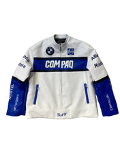 White jacket with blue accents and branding on a textured stone wall background