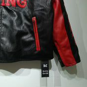 Black leather jacket with red accents and a visible brand tag on a white background