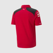 Red polo shirt with black shoulders on a white background