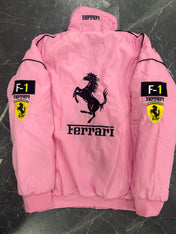 Pink Ferrari jacket with logo and branding on a dark textured background