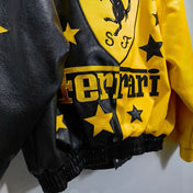 Yellow and black Ferrari jacket with logo and text on a gray background