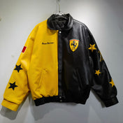 A vintage Ferrari racing jacket with a black and yellow color scheme, featuring star patterns and the Ferrari logo on the chest.