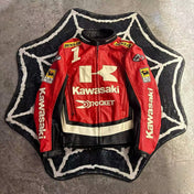 Red Kawasaki motorcycle jacket on a textured surface