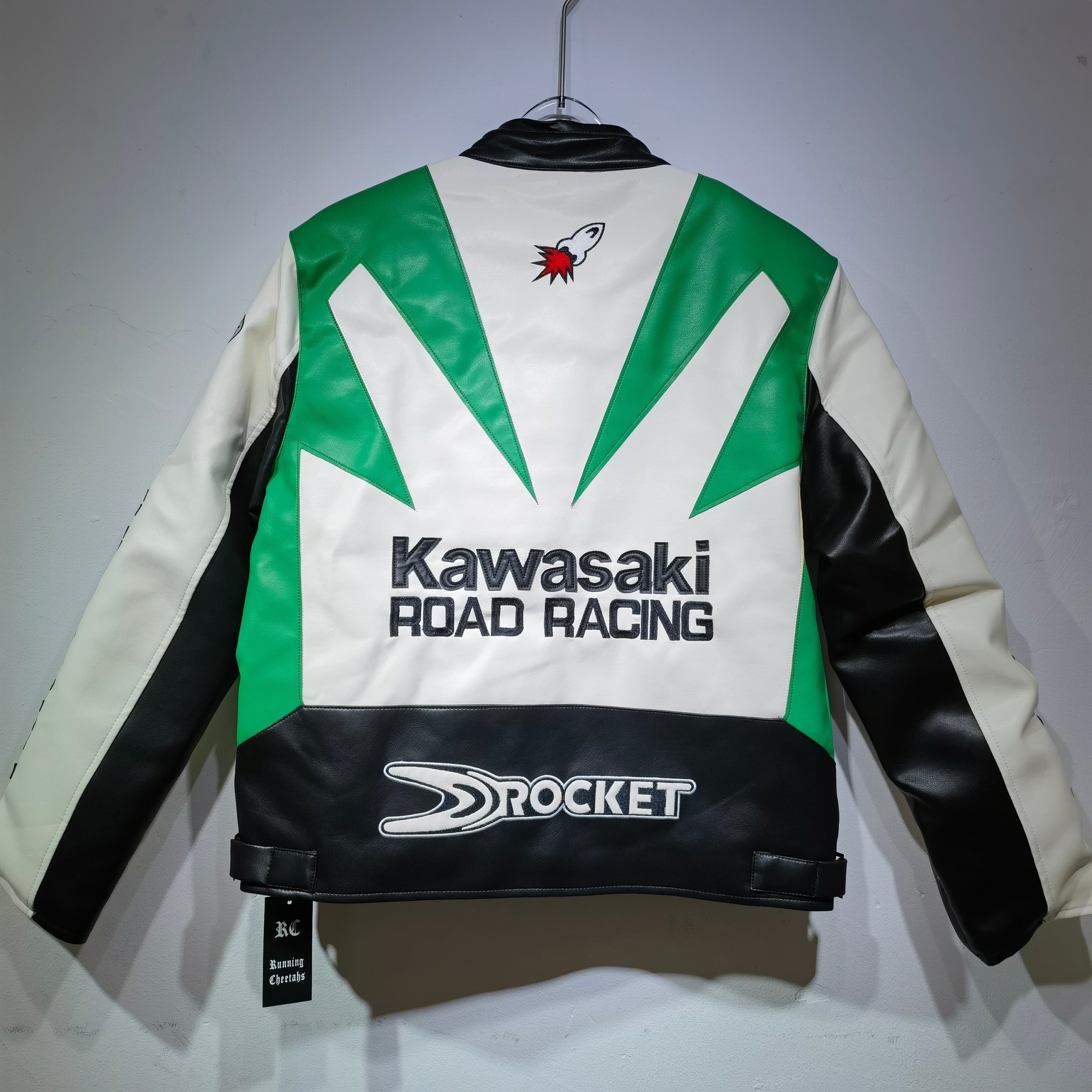 Kawasaki Road Racing jacket with green, white, and black design on a gray background