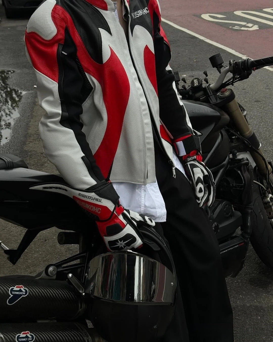 Motorcycle jacket with red, black, and white design on a motorcycle