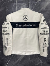 White racing jacket with Mercedes-Benz logo and various sponsor names on a dark marble background