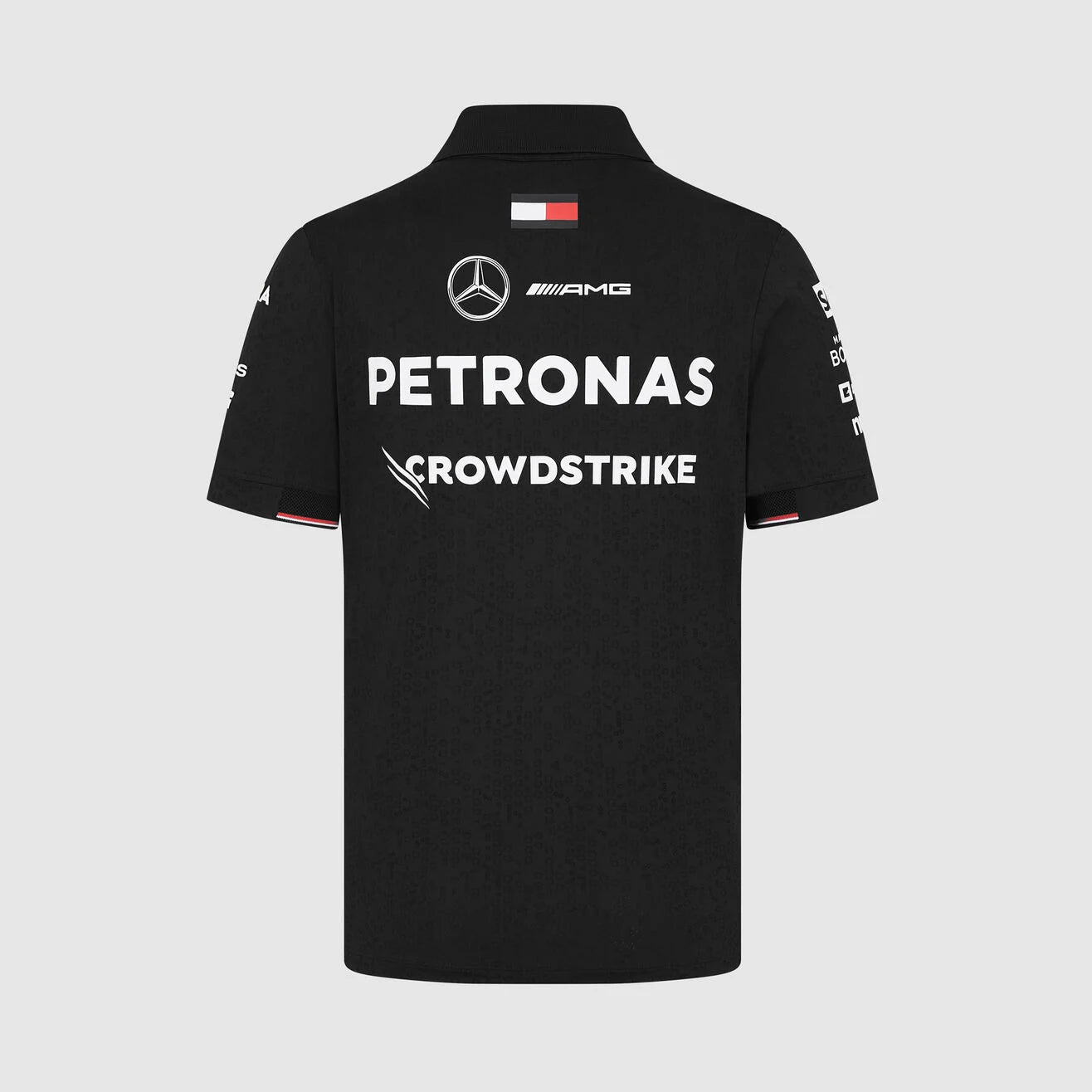Black polo shirt with Mercedes-Benz and Petronas logos on a light gray background