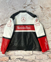 Mercedes-Benz leather jacket with branding on a textured stone background
