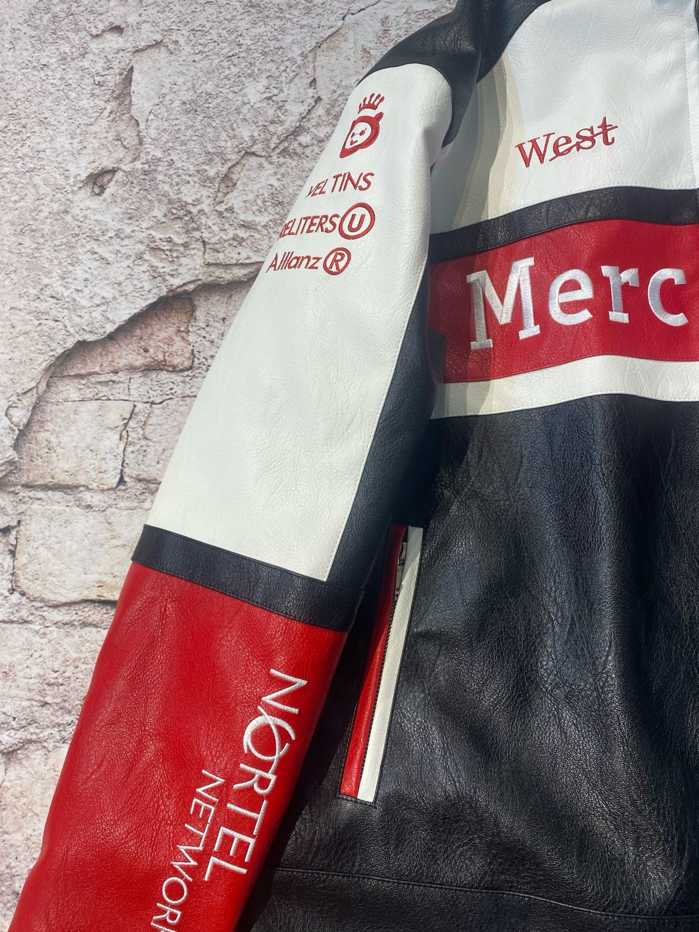 Close-up of a leather jacket with visible branding on a textured background