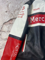 Close-up of a leather jacket with visible branding on a textured background