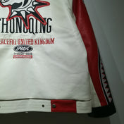 White jacket with red and black accents featuring text and logos on a plain background