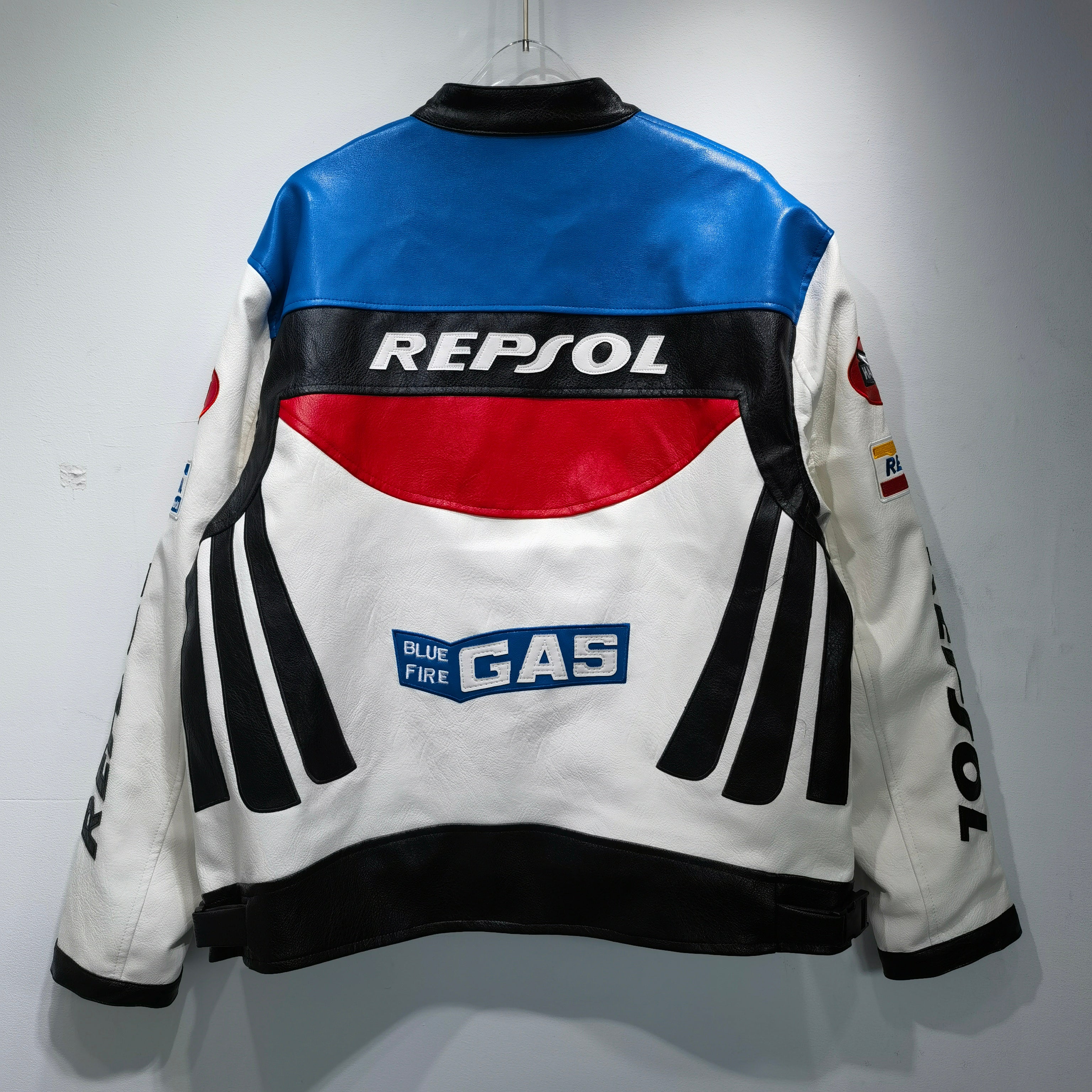 Leather jacket with Repsol and Gas logos on a white background