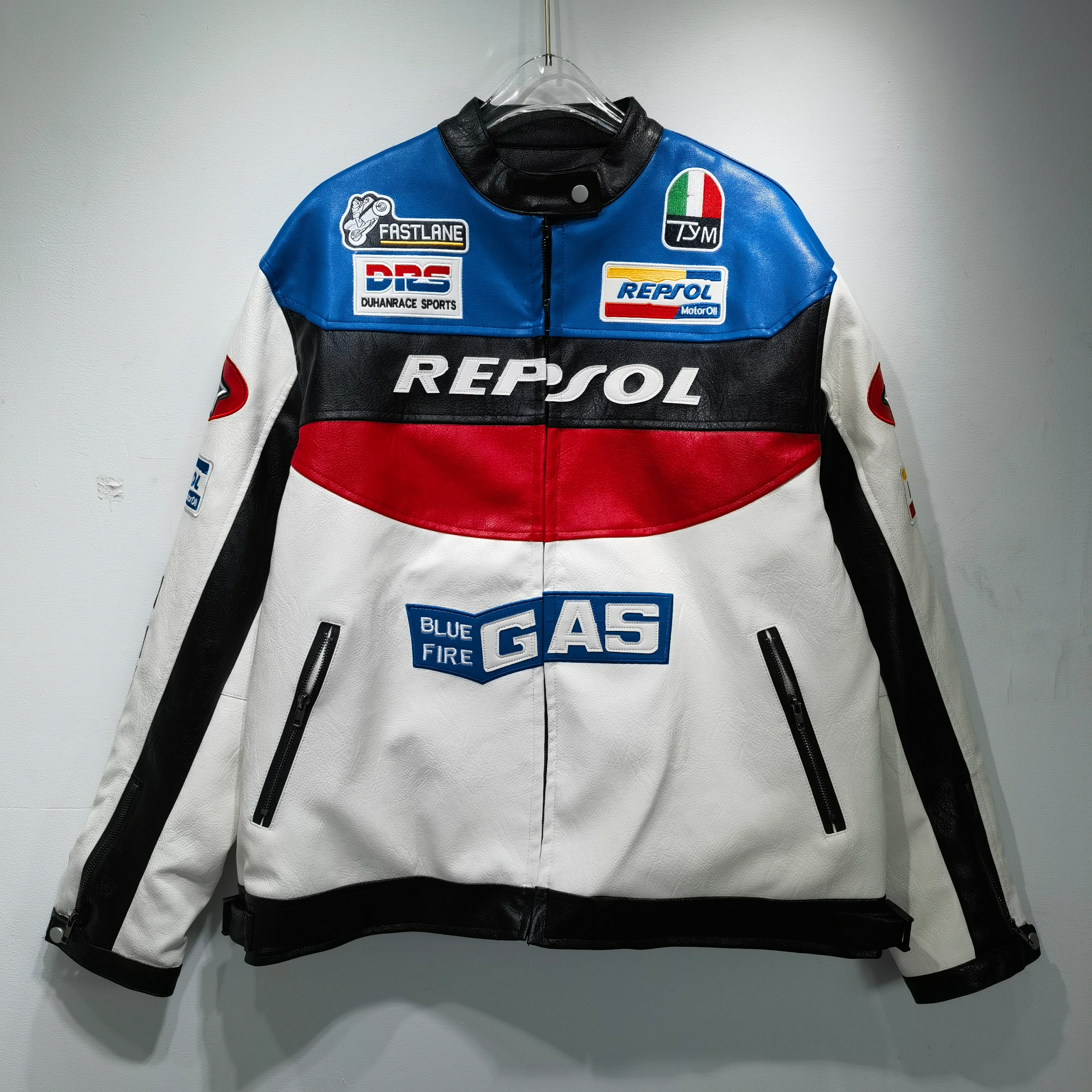Repsol branded jacket with various logos on a gray background